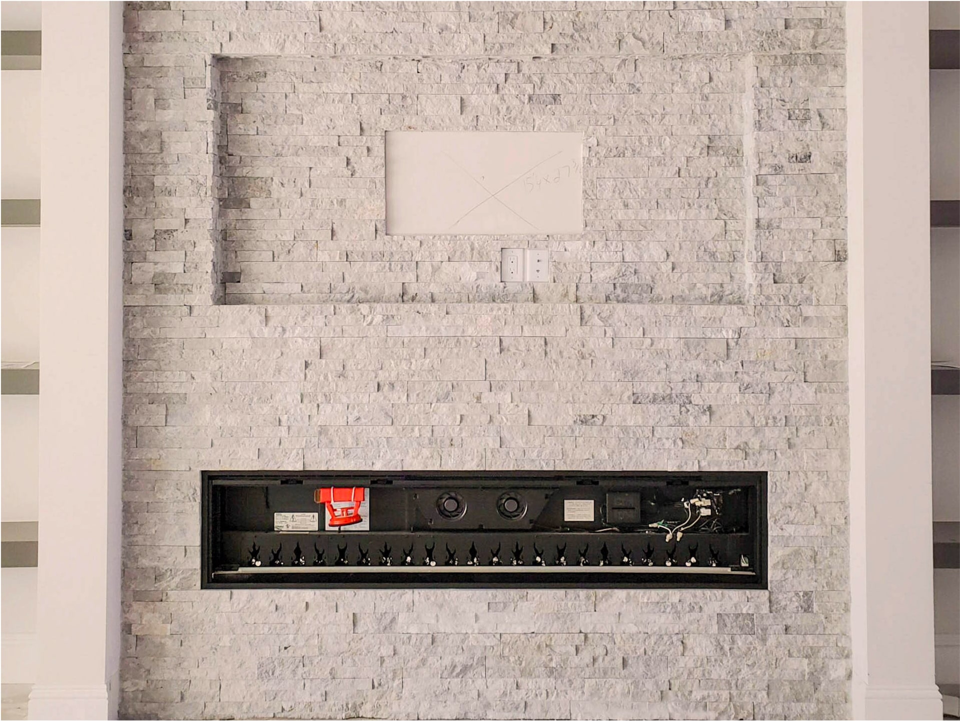 Stacked-marble fireplace surround interior — JBA stone install